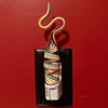 Decorative wall sculpture with wavy design 